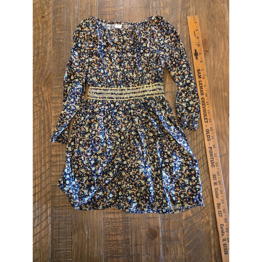 Tiny Sugar Dress Kids size 7 label and a colorful floral pattern on a black...